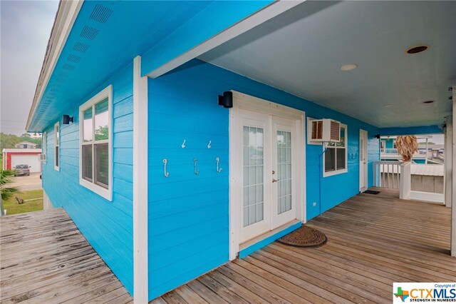 wooden terrace featuring french doors