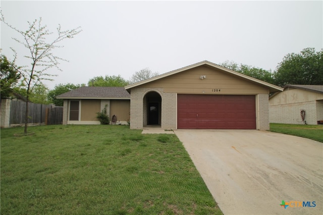 ranch-style house with a garage and a front yard