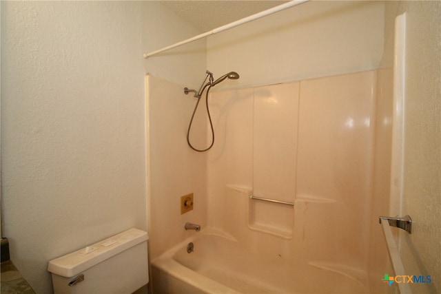 bathroom featuring toilet and tub / shower combination