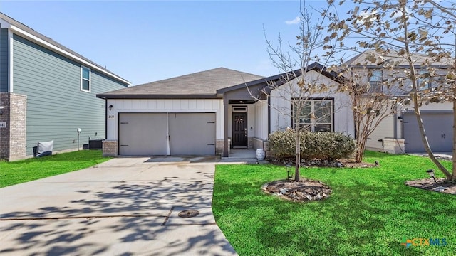 view of front of home with a garage and a front yard