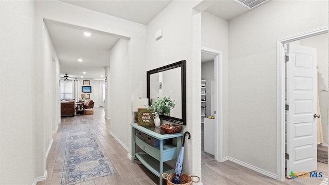 corridor featuring light hardwood / wood-style floors