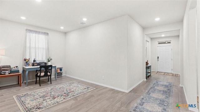 office space with light hardwood / wood-style floors