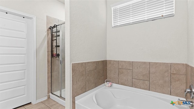 bathroom featuring tile patterned floors and plus walk in shower