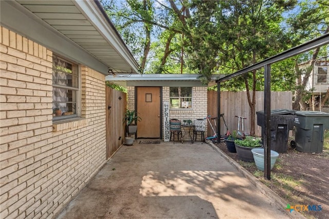 view of patio / terrace featuring fence