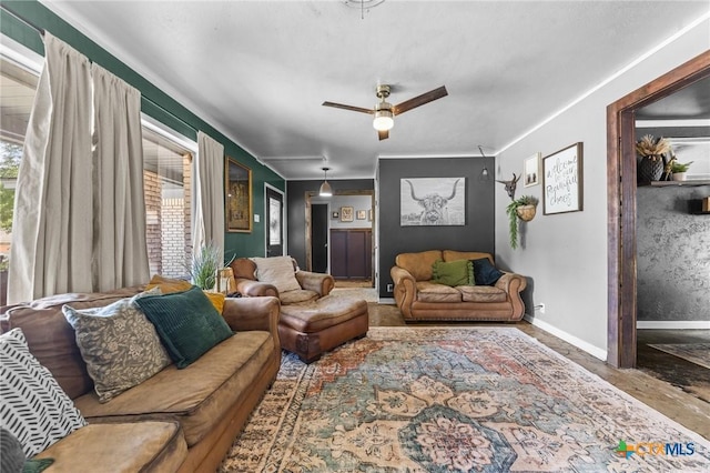 living area featuring a ceiling fan