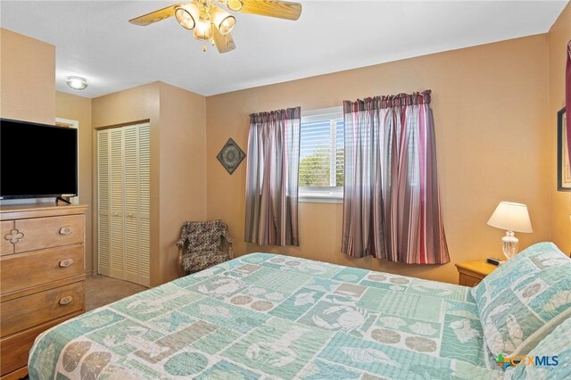 144 Sherwood Dr, Rockport, TX 78382 - carpeted bedroom featuring a closet and ceiling fan