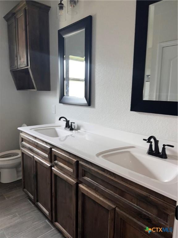 806 Dred Roger Cir, Killeen, TX 76542 - full bathroom featuring double vanity and wood finished floors