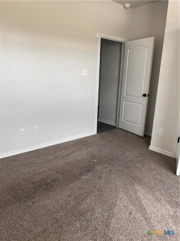 806 Dred Roger Cir, Killeen, TX 76542 - unfurnished room featuring dark carpet