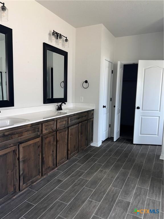 806 Dred Roger Cir, Killeen, TX 76542 - bathroom with double vanity and wood finish floors