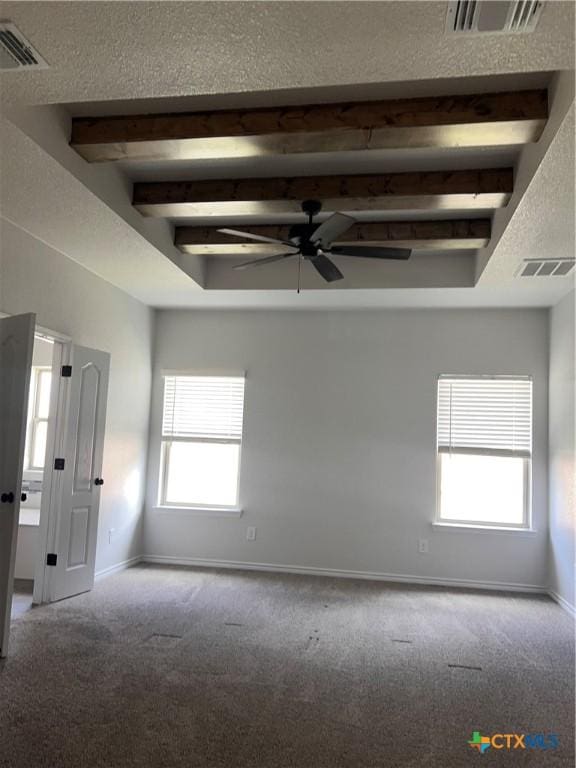 806 Dred Roger Cir, Killeen, TX 76542 - unfurnished room featuring carpet, a ceiling fan, and beamed ceiling