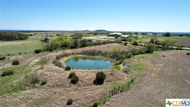 bird's eye view featuring a water view and a rural view