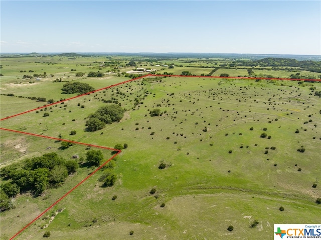 birds eye view of property with a rural view