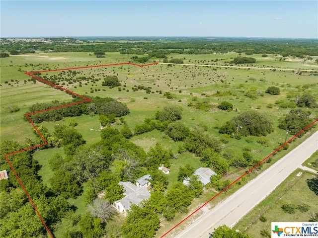 birds eye view of property featuring a rural view