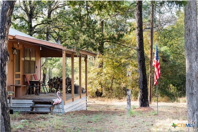 view of yard featuring a wooden deck