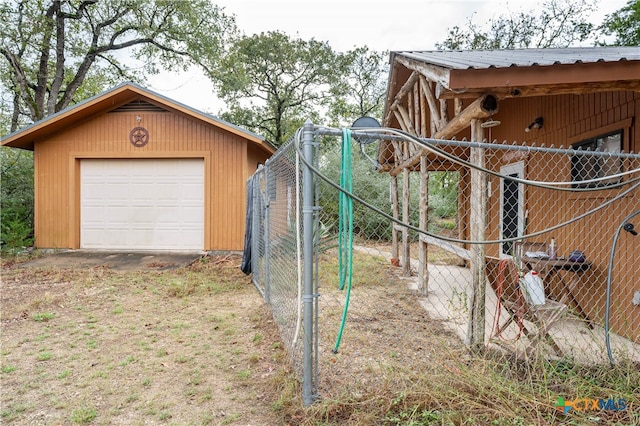 exterior space featuring an outbuilding and a garage