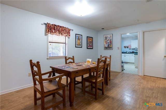 dining space featuring hardwood / wood-style flooring