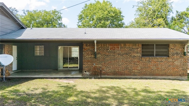 405 Carothers St, Copperas Cove, TX 76522 - back of property featuring a yard, a patio area, and brick siding