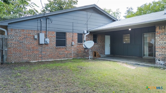 405 Carothers St, Copperas Cove, TX 76522 - view of front of home with a front yard, brick siding, and a patio area