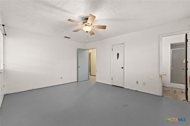 405 Carothers St, Copperas Cove, TX 76522 - unfurnished bedroom with finished concrete flooring, a textured ceiling, and a ceiling fan