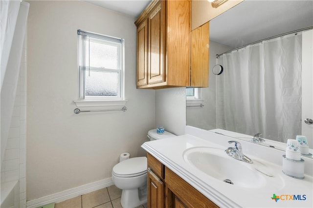 bathroom with vanity, tile patterned floors, and toilet