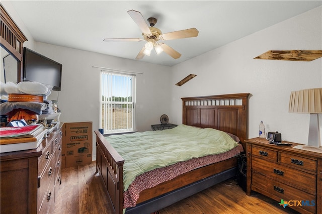 bedroom with dark wood-type flooring and ceiling fan