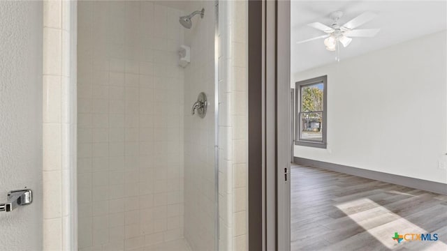 603 E Cedar St, Seguin, TX 78155 - bathroom with a stall shower, wood finished floors, and ceiling fan