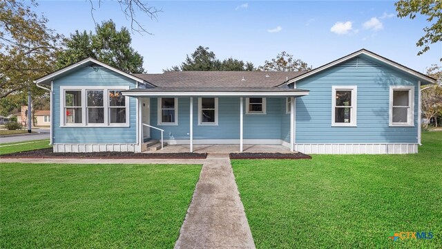 view of front of property with a front yard and a porch