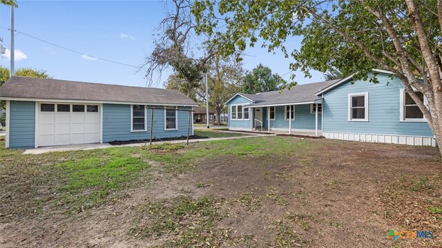 ranch-style house with a porch and a garage