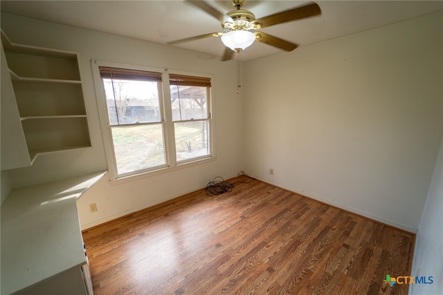 unfurnished room featuring wood-type flooring and ceiling fan