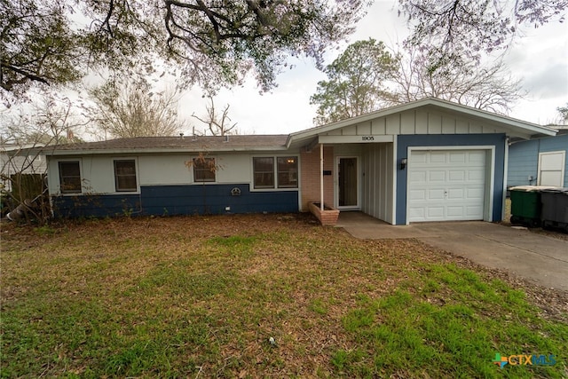 ranch-style house with a garage and a front yard