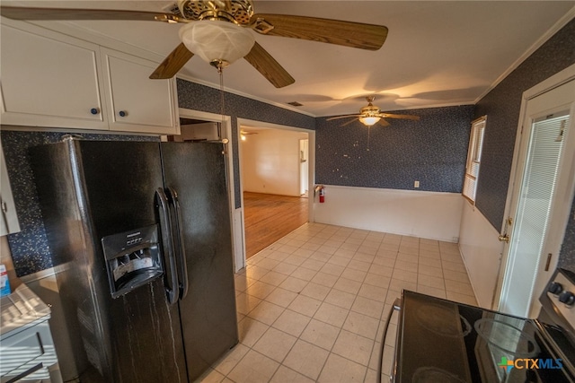 kitchen with white cabinetry, crown molding, black fridge with ice dispenser, and light tile patterned floors