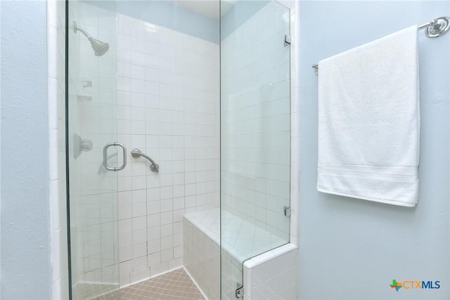 bathroom featuring an enclosed shower