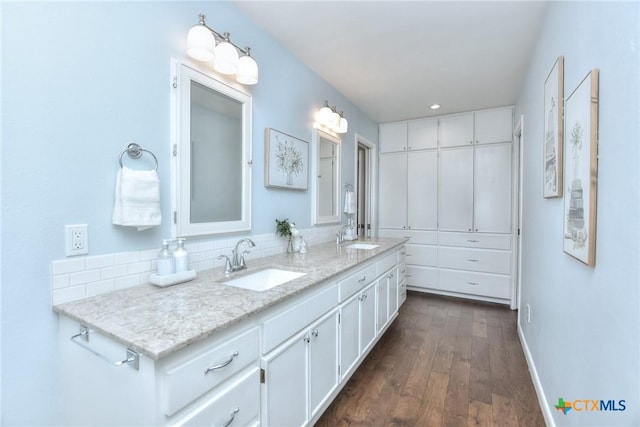 bathroom with vanity and hardwood / wood-style floors