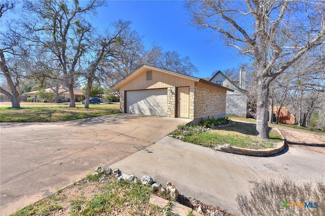 view of side of home with an outbuilding and a garage