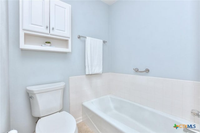 bathroom with a bathing tub and toilet