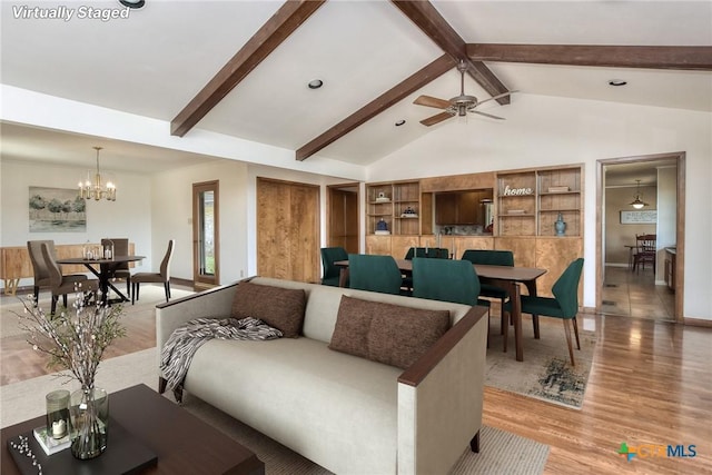 living room featuring hardwood / wood-style floors, ceiling fan with notable chandelier, and lofted ceiling with beams