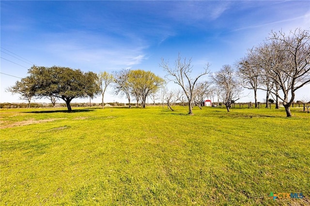 view of yard with a rural view