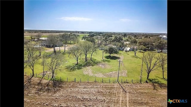 birds eye view of property with a rural view