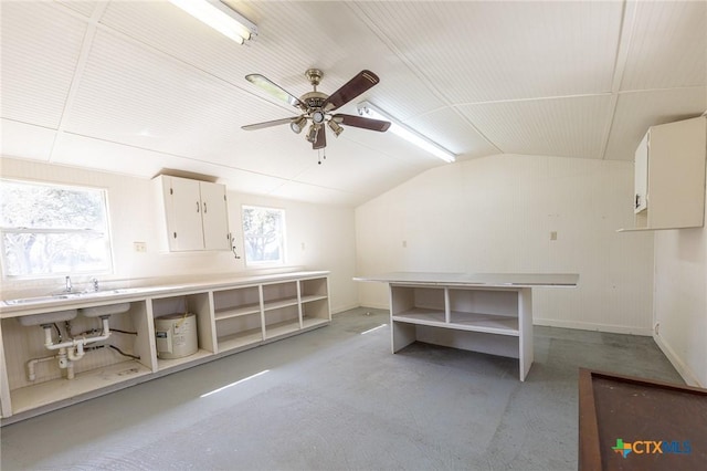 interior space featuring a ceiling fan and baseboards