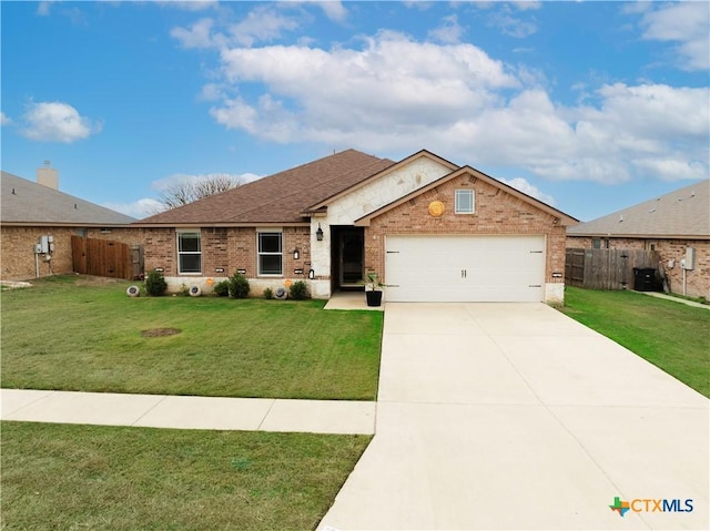 single story home featuring a garage and a front lawn