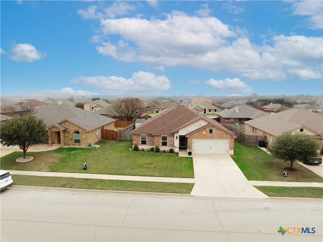 single story home featuring a garage and a front yard