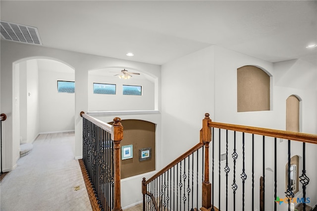 2051 Western Pecan, New Braunfels, TX 78130 - hall featuring recessed lighting, an upstairs landing, visible vents, and arched walkways