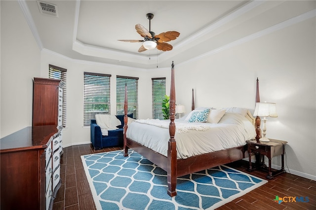 2051 Western Pecan, New Braunfels, TX 78130 - bedroom featuring a raised ceiling, crown molding, visible vents, baseboards, and wood finished floors