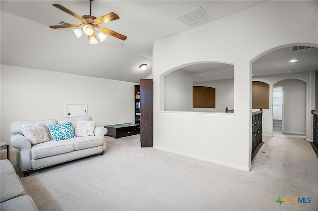 2051 Western Pecan, New Braunfels, TX 78130 - carpeted living area with ceiling fan, visible vents, vaulted ceiling, baseboards, and arched walkways