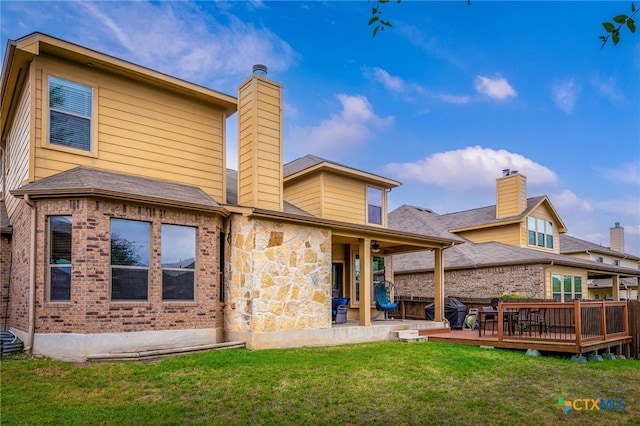 2051 Western Pecan, New Braunfels, TX 78130 - back of property with a chimney, a yard, brick siding, and a wooden deck