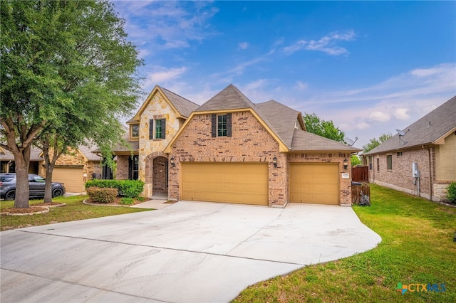 2051 Western Pecan, New Braunfels, TX 78130 - traditional-style home with concrete driveway, a front yard, brick siding, and a garage