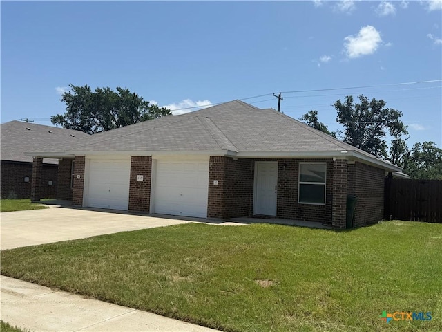 1307 Liberation Ln, Copperas Cove, TX 76522 - single story home with an attached garage, brick siding, driveway, and a shingled roof