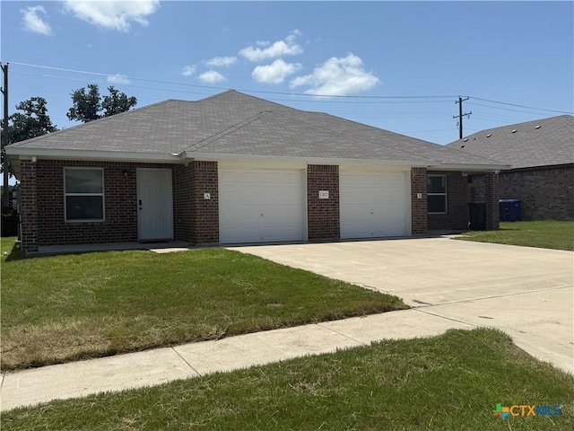 1307 Liberation Ln, Copperas Cove, TX 76522 - ranch-style house with a garage, driveway, brick siding, a front yard, and roof with shingles