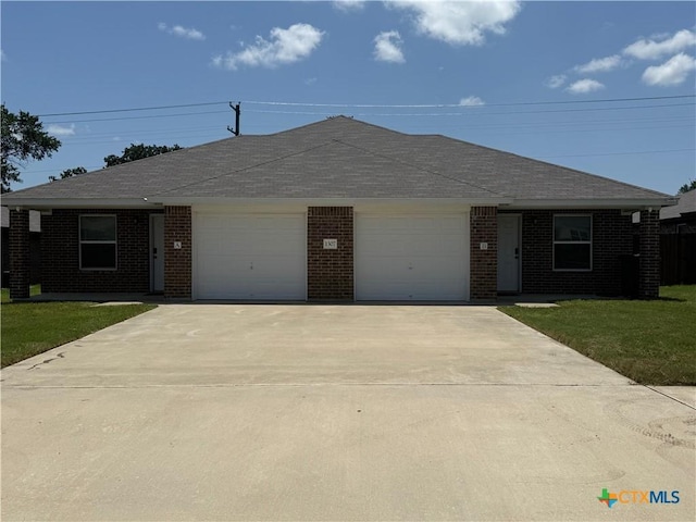 1307 Liberation Ln, Copperas Cove, TX 76522 - ranch-style house featuring a garage, brick siding, concrete driveway, and a front yard