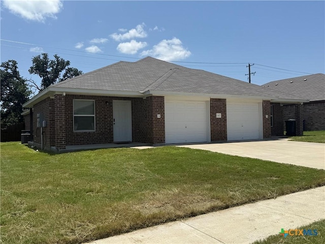 1307 Liberation Ln, Copperas Cove, TX 76522 - ranch-style house with a garage, concrete driveway, brick siding, a front lawn, and a shingled roof